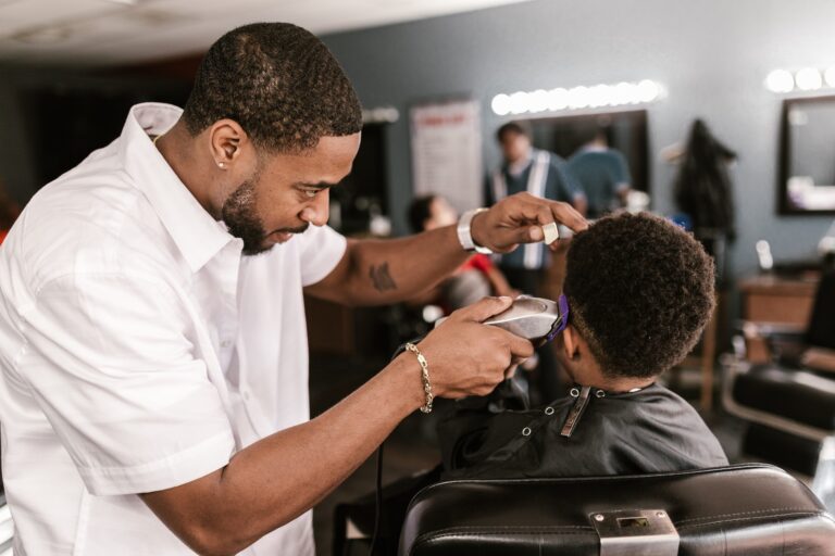 Barber cutting a kid's hair
